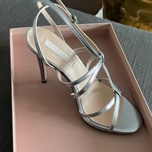 Brand new silver strappy high heels.